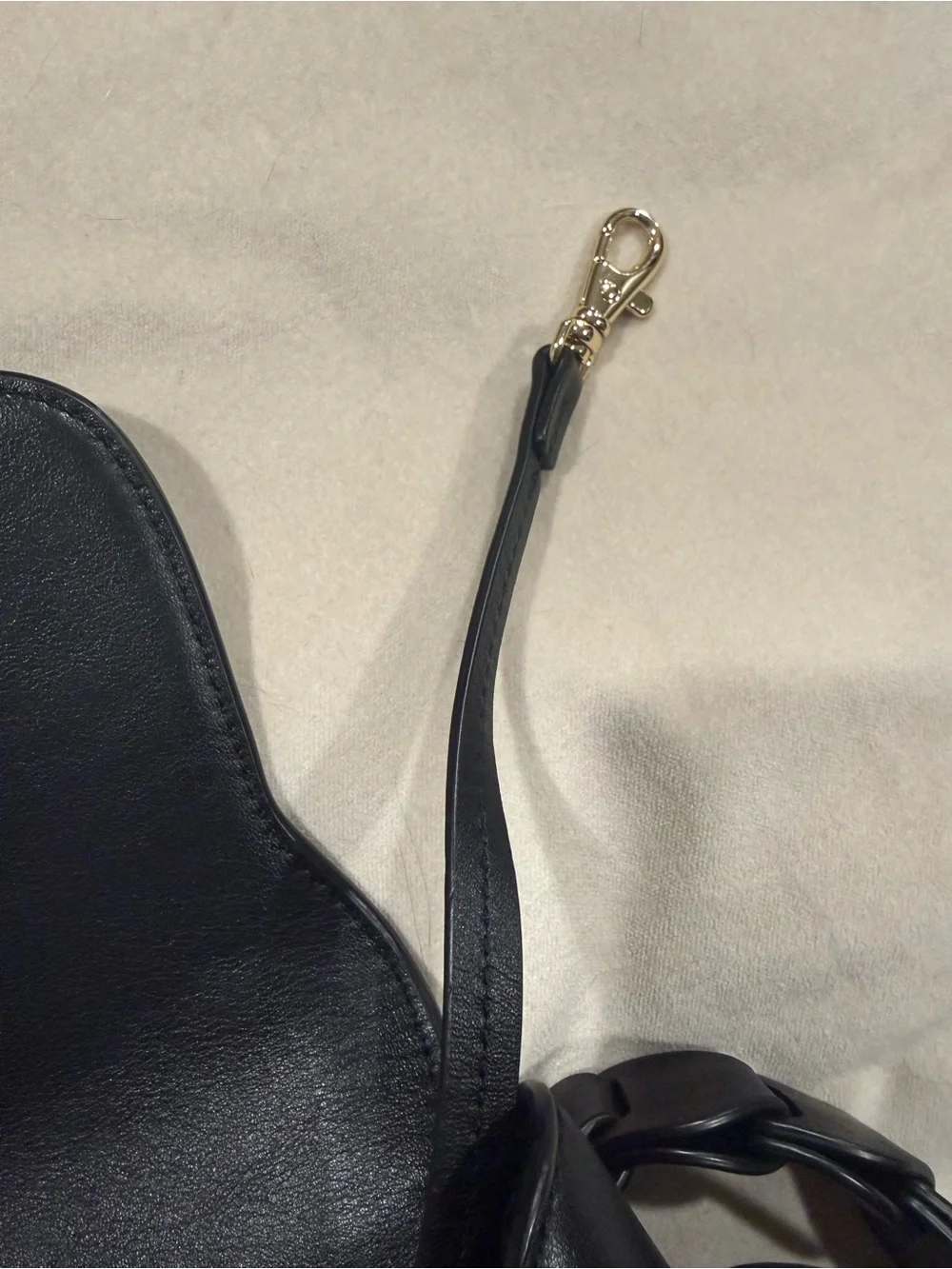 ⁠MICHAEL KORS Jolene black leather saddle bag with interlocking woven strap